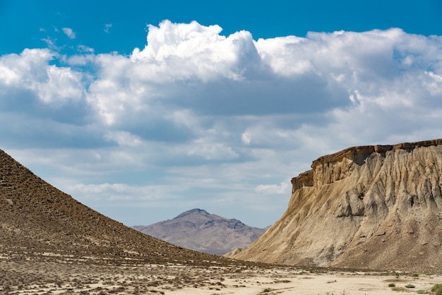 Clouds over rocks in a desert area