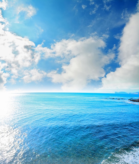 Cloudy sky over Alghero blue sea Sardinia