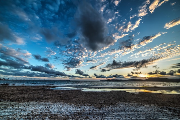 Cloudy sky at sunset in Alghero Sardinia