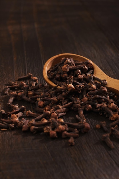 Cloves close up detail on wooden background