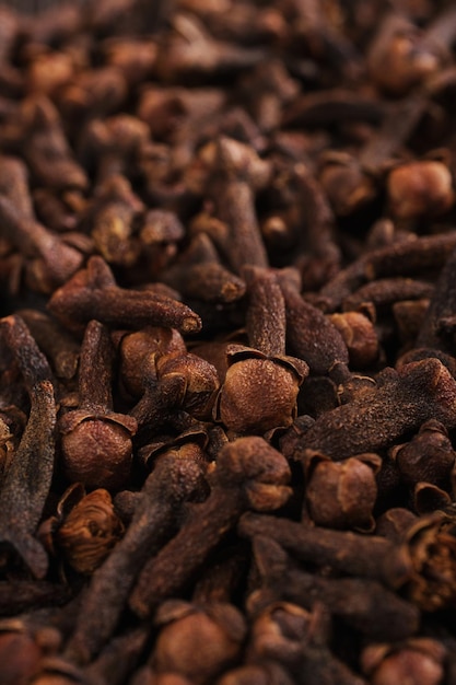 Cloves close up detail on wooden background