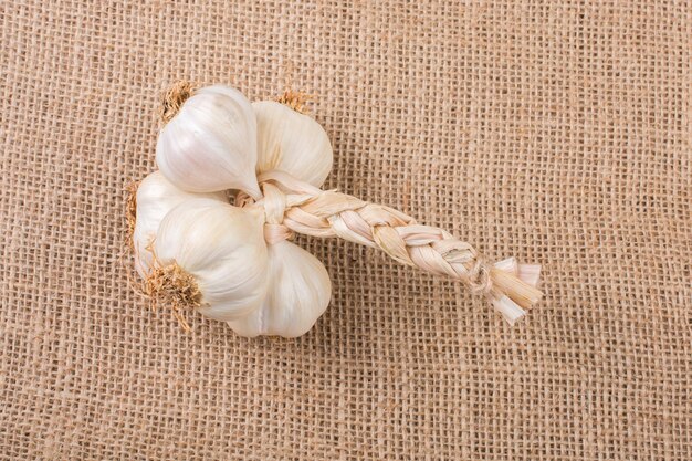 Cloves of garlic on a canvas texture