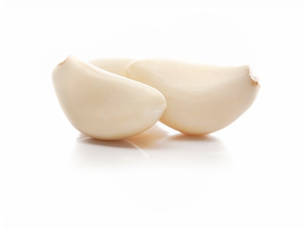 Cloves of Peeled Garlic Isolted on White