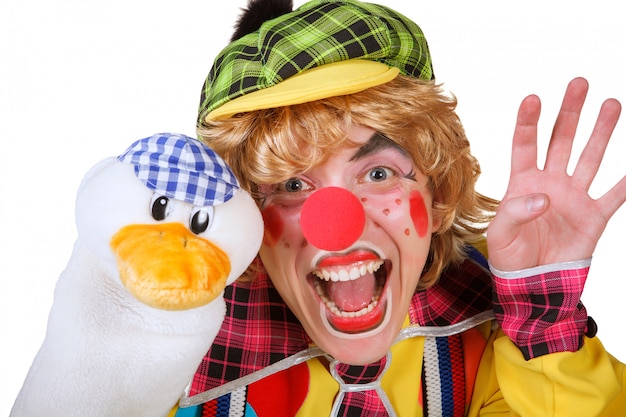 Clown with duck and makeup isolated on white background