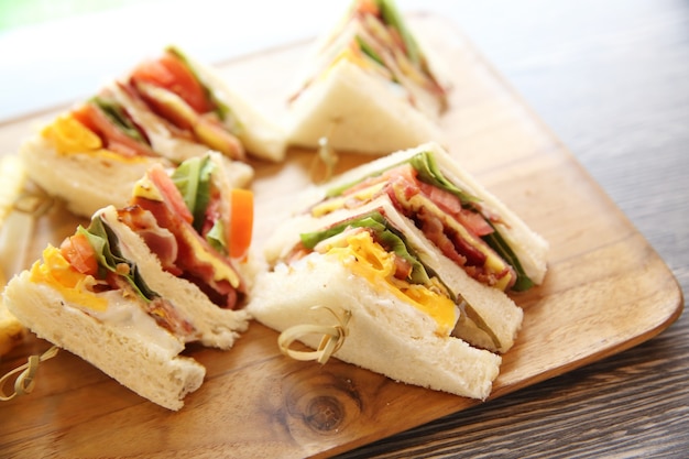 Club sandwich with on wood background