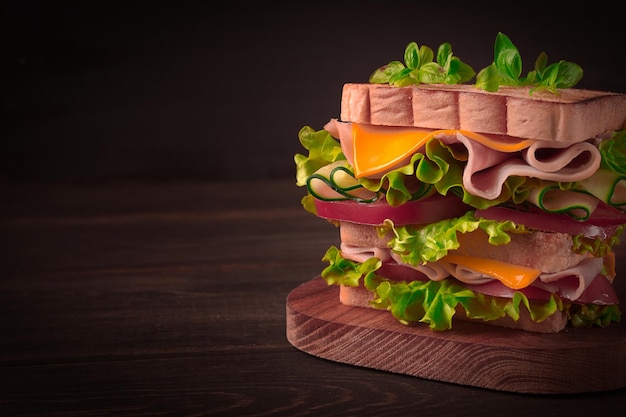 Club sandwich on a wooden table rustic style closeup no people homemade