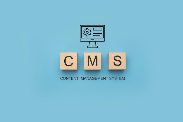 CMS Content Management System banner CMS Block letters on blue background Cms written on a wooden cubes website management software internet technology concept