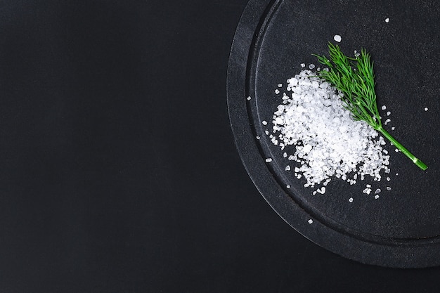 Coarse salt crystals on a black table