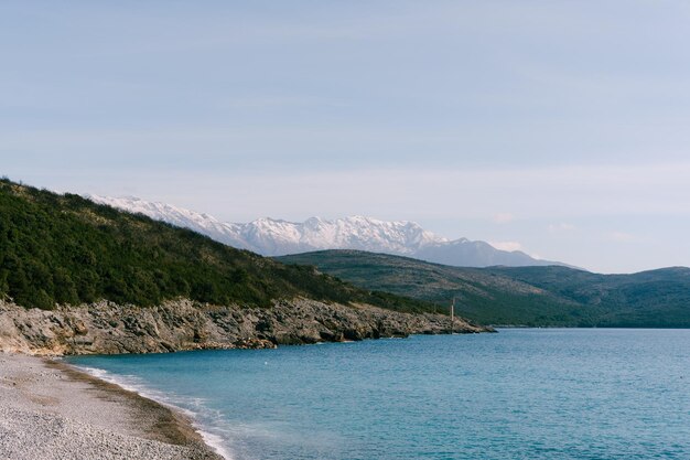 Coast of the bay of kotor against the backdrop of mountains