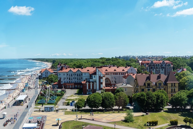 The coast of the city of Zelenogradsk with a view of the embankment houses and pier top view