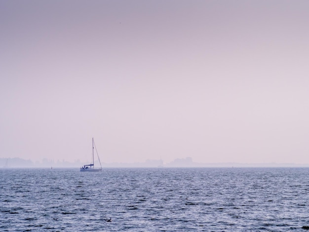 Coast line and beach with sea view in Volendam, Netherlands, under blue sky