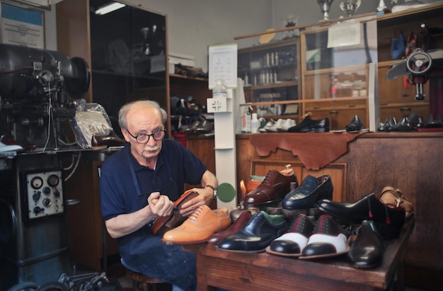 cobbler works in his workshop