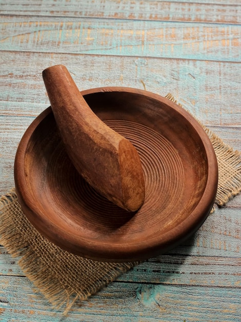 Cobek dan uleg or Mortar and Pestle made of ironwood or kayu ulin with a spiral motif