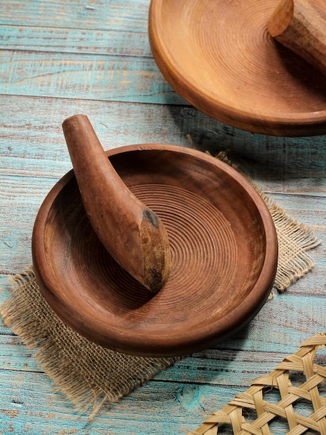 Cobek dan uleg or Mortar and Pestle made of ironwood or kayu ulin with a spiral motif