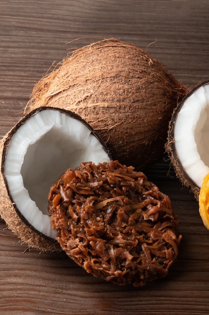 Photo cocada coconut candy on rustic wood background.