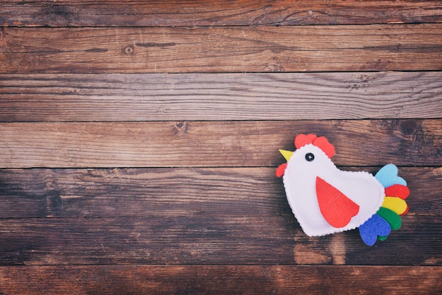 Cock on wooden background