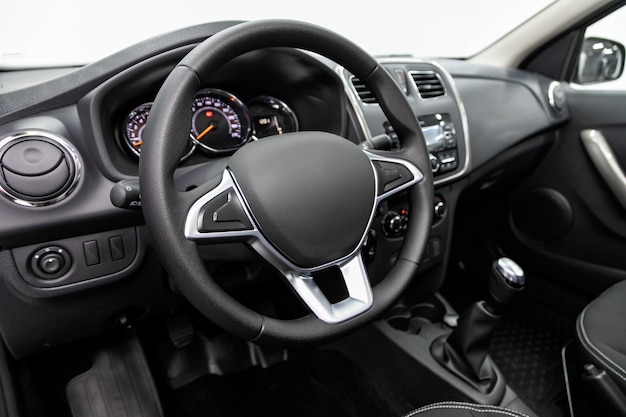 Cockpit interior cabin details, speedometer and tachometer. Black leather interior.