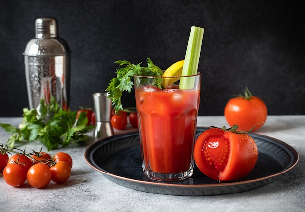 cocktail Bloody Mary with ice, lemon, and celery