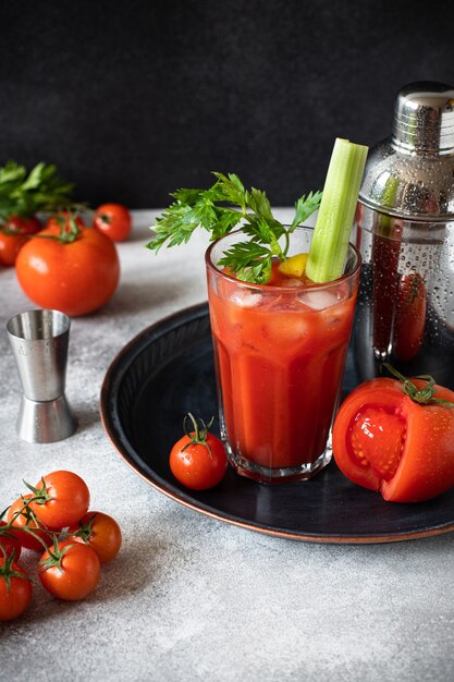 cocktail Bloody Mary with ice, lemon, and celery