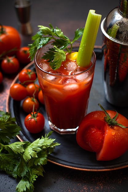 cocktail Bloody Mary with ice, lemon, and celery