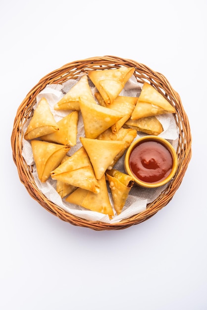 Cocktail mini triangle samosa made using patti or strip, popular home made snack from India