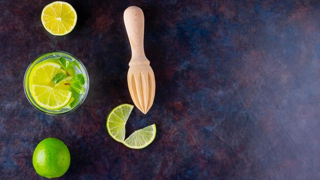 Cocktail mojito with lime and mint in glass One glass of mojito on a dark background