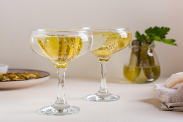 Cocktail with pickles in glasses on the table Homemade drinks