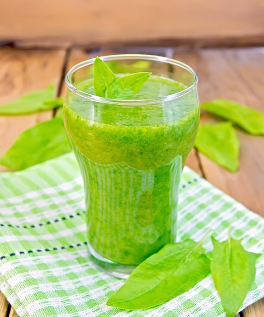 Cocktail with spinach on the board