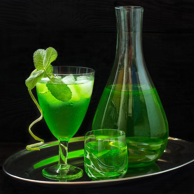 Cocktail with tarragon mint and ice