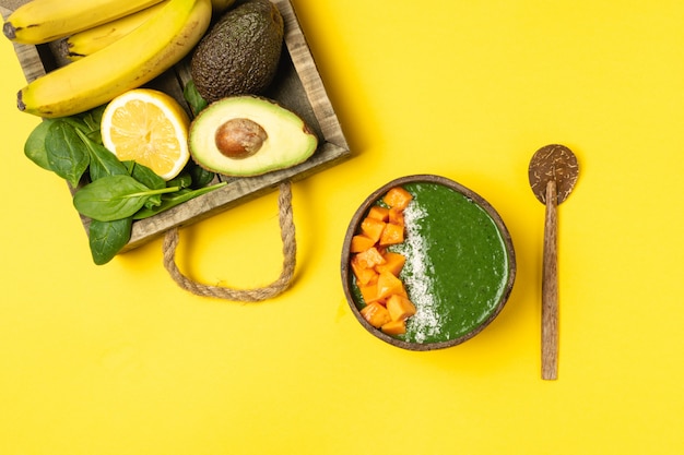 coconut bowl with green fruit smoothie