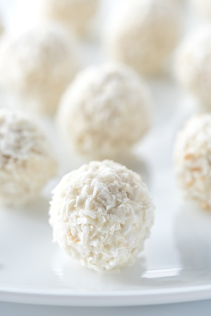 Coconut candies on white plate