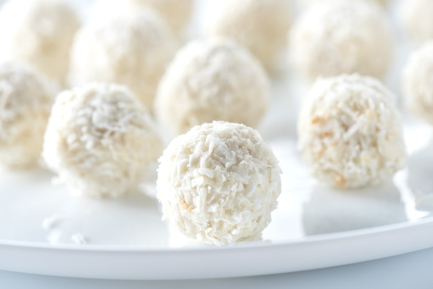 Coconut candies on white plate