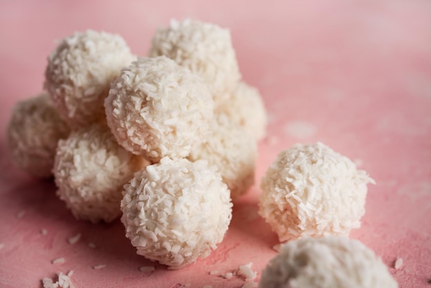 Coconut candies with nuts on pink background Raffaello High quality photo