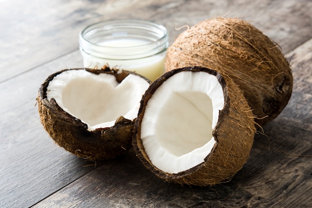 Coconut and coconut milk on wooden table