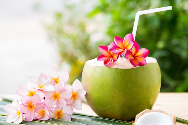 coconut drink decoration with fangipani flower.