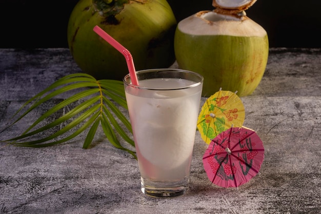 Coconut juice with fresh young coconut fruit isolated on white background