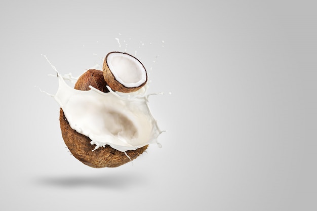 Coconut Milk Splashing isolated on Green background