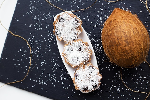 Coconut muffins on a black background