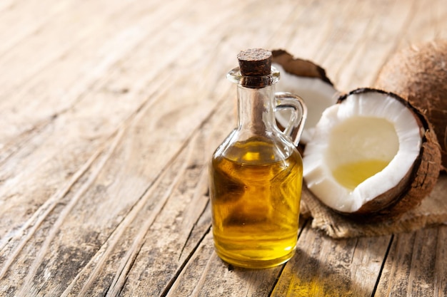 Coconut oil and bottle oil on wooden table