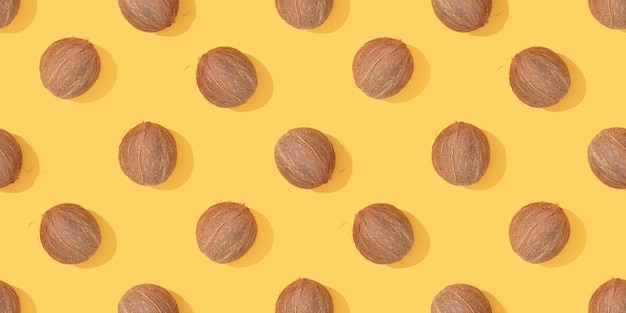 Coconuts seamless pattern on a yellow background