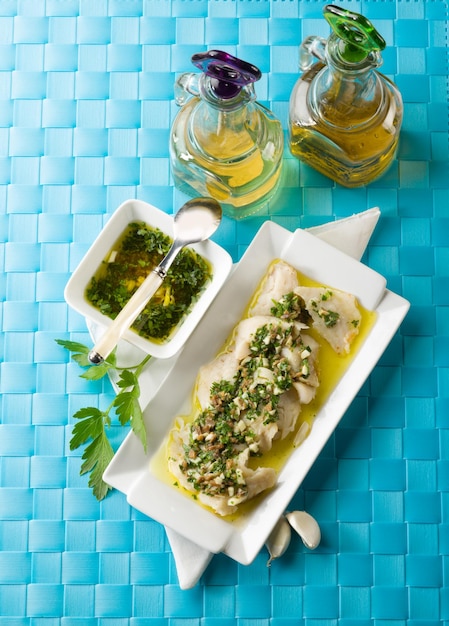 Cod fillet marinated with parsley anchovy and garlic