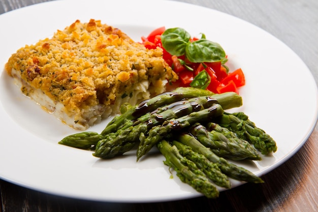 Cod fish with crispy breadcrumbs and asparagus