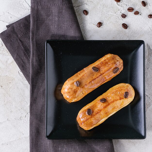 Coffe eclair with coffee beans