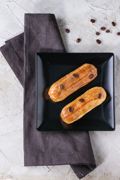 Coffe eclair with coffee beans