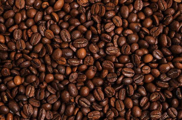 Coffee beans background close up.