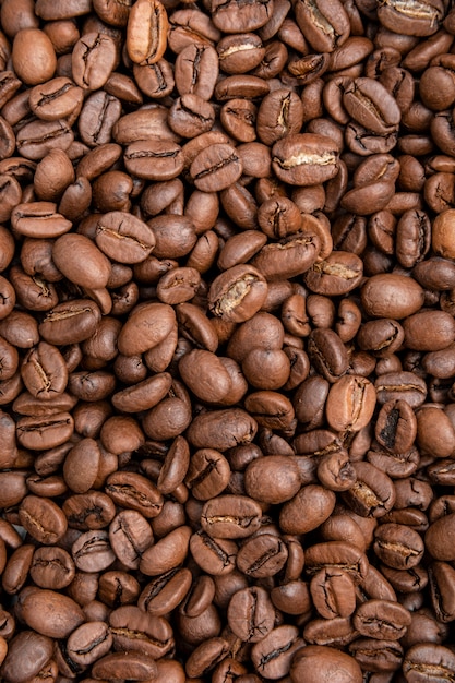 Coffee beans background. Mixture of different kinds of coffee beans.