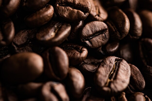 Coffee beans background roasted signature bean with rich flavour best morning drink and luxury blend