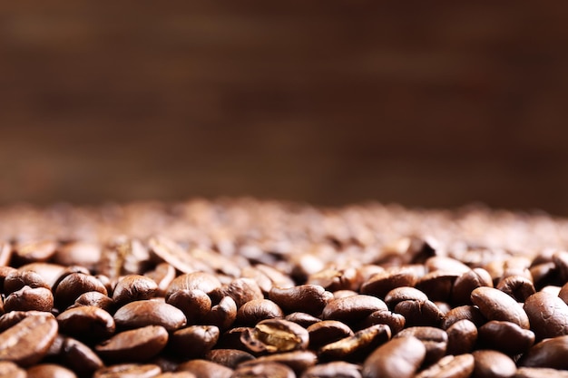 Coffee beans on brown background