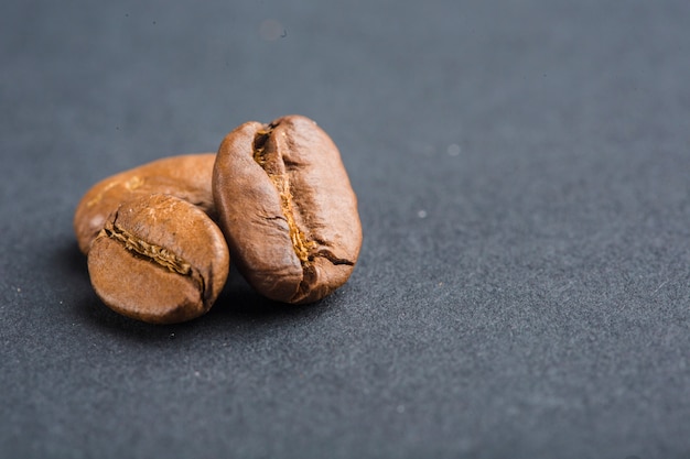 Coffee beans closeup on black background with copyspace