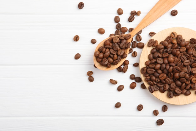 Coffee beans on a colored background place to insert text minimalism